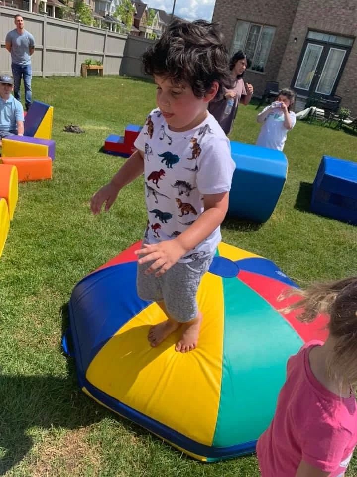 Children happily engaging in summer camp outdoor activities